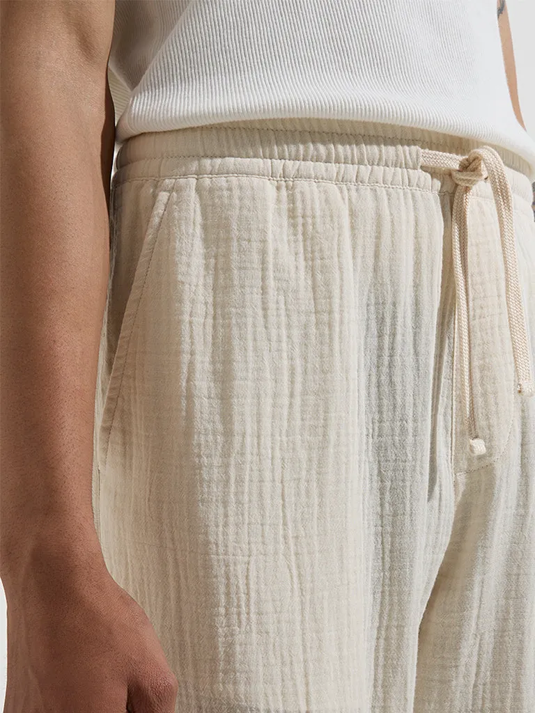 ETA Off-White Textured Relaxed-Fit Mid-Rise Cotton Chinos
